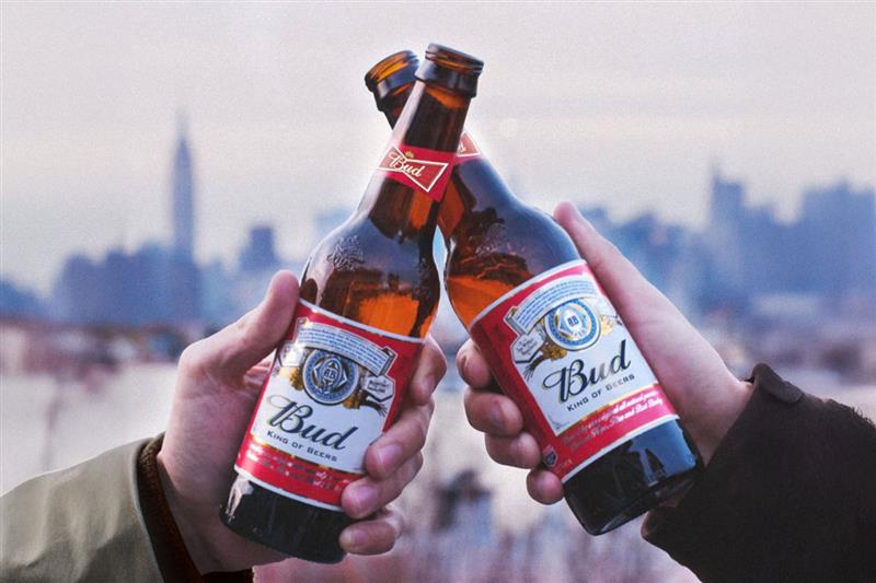 A group of pople clinking beer mugs.